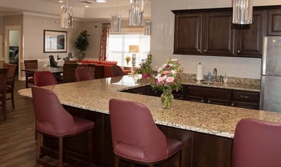 Modern common area with a kitchen bar and seating