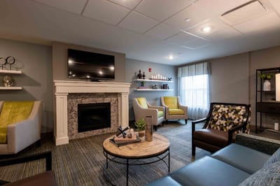 Cozy common area with seating and a fireplace