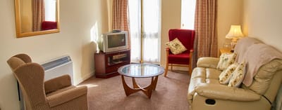Cozy common area with comfortable seating and a television