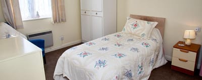Private resident room with a bed and furniture