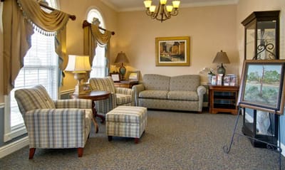 Cozy lounge area with seating and artwork