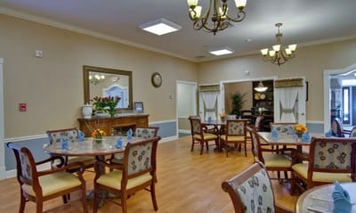 Bright dining area with tables and chairs