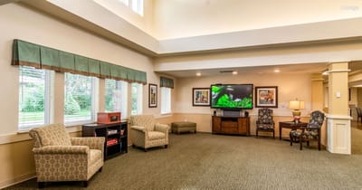 Interior lounge area with comfortable seating and a TV