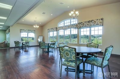 Interior view of a common area with tables and chairs