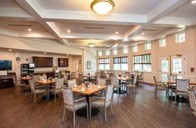 Bright dining room with tables set for meals