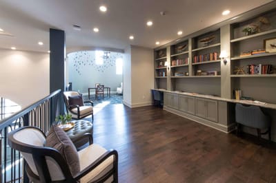 Common area with seating and bookshelves