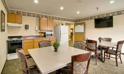 Bright and clean common kitchen area with seating