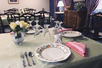 Dining table set for a meal in a communal area