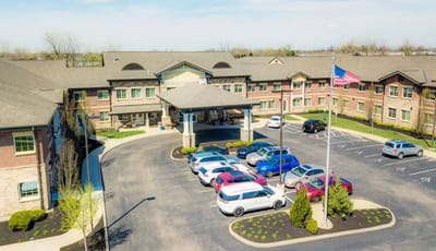 Aerial view of the assisted living facility with parking and landscaping