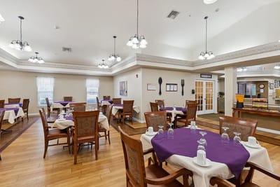 Dining area with tables set for residents