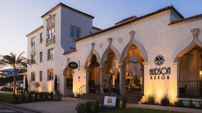 Exterior view of Hudson Manor Assisted Living at sunset