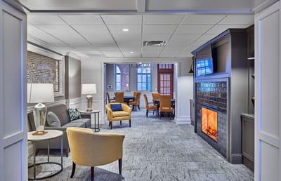 Cozy common area with seating and fireplace