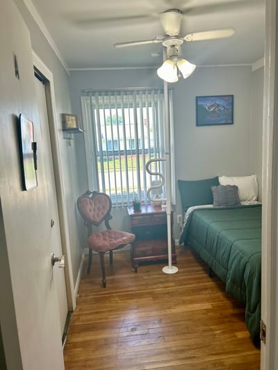 A well-furnished private resident room with natural light