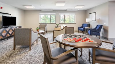 Common area with a checkers game setup and seating