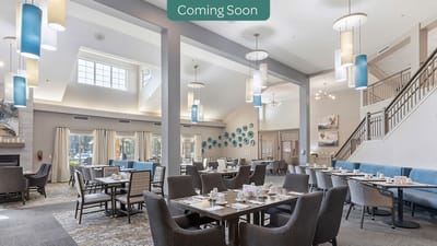 Dining area with tables and chairs, bright lighting
