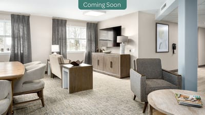 Bright and modern common area with seating and dining table