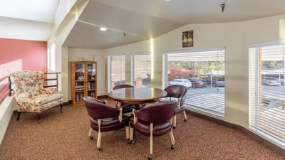 Bright common area with seating and bookshelves