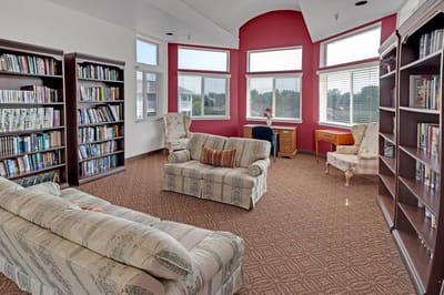 Cozy reading area with bookshelves and seating