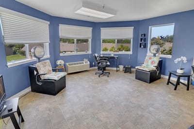 Bright common area with seating and windows
