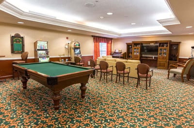 Common area with a pool table and seating
