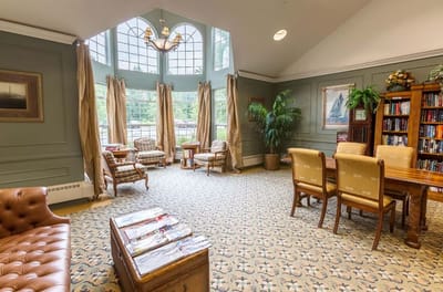 Common area with seating and bookshelves