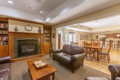 Cozy interior common area with a fireplace and seating