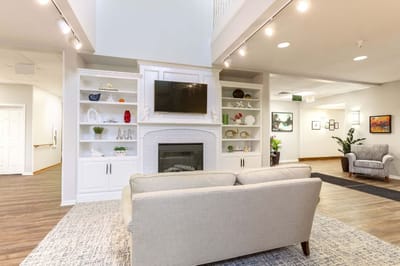Bright common area with cozy seating and decor