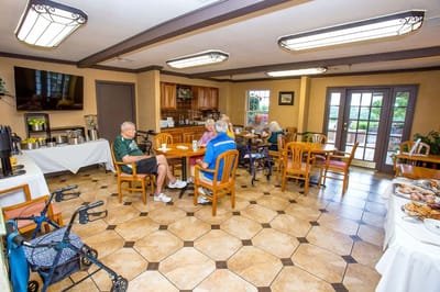 Residents enjoying snacks in a dining area