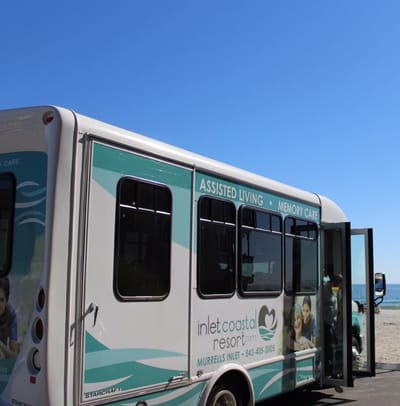 Facility shuttle bus outside near the beach