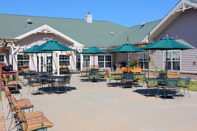 Outdoor patio area with seating and umbrellas