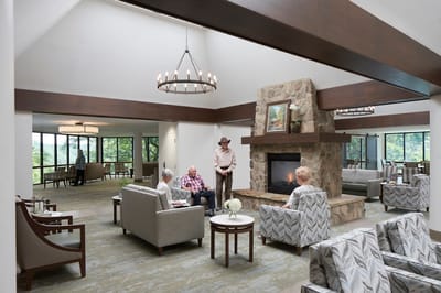 Residents and staff socializing in a cozy common area