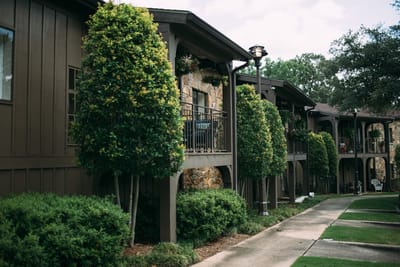 Outdoor view of the facility with greenery and balconies