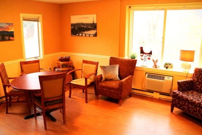 Cozy common area with chairs and a table