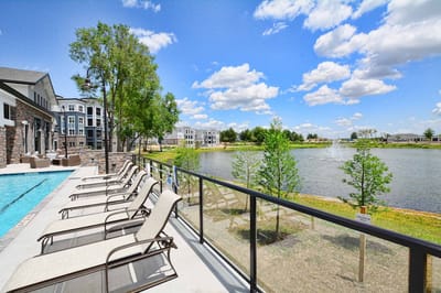 Beautiful outdoor pool area overlooking a scenic lake