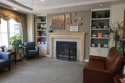Cozy common area with seating and a fireplace