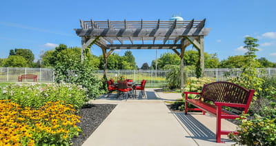Beautiful outdoor seating area with flowers and benches