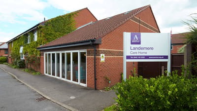 Exterior view of Landemere Care Home with signage