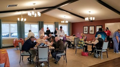 Residents enjoying a meal in a common area