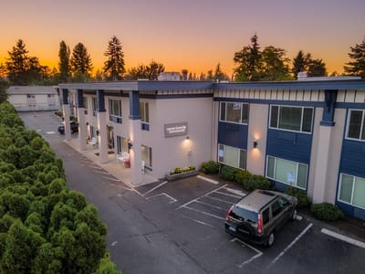 Exterior view of Laurel Cove Community building at sunset