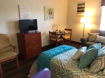 Cozy interior of a resident room with furniture