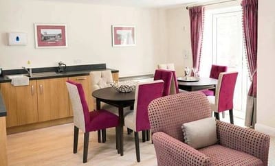 Interior common area with seating and kitchenette