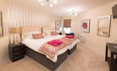 Brightly decorated resident room with twin beds