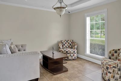 Bright common area with seating and a view outside