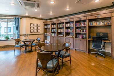 Interior common area with bookshelves and tables
