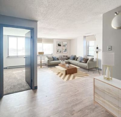 Bright, modern common area with a sofa and aesthetic decor