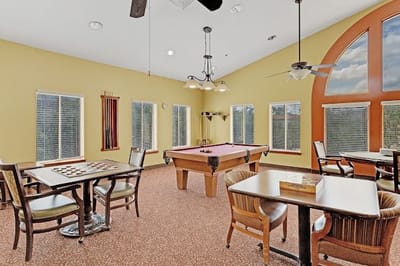 Bright common area with pool table and seating