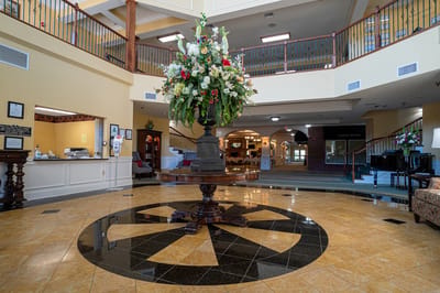 Interior view of a vibrant lobby with floral arrangement