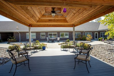 Outdoor seating area with a gazebo and chairs