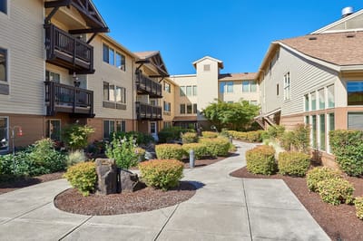 Pathway through a landscaped courtyard at Marian Estates