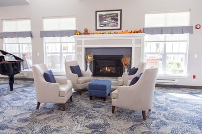 Bright common area with comfortable seating and fireplace